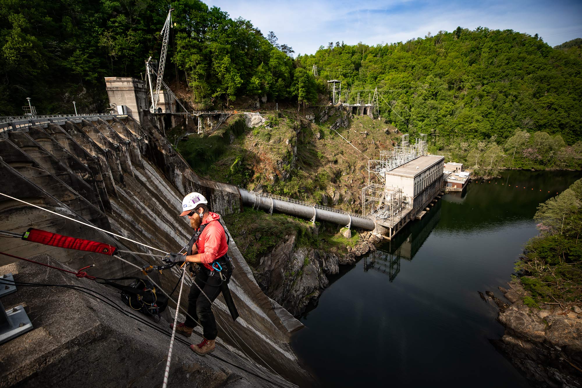 A technician rappels down a hydroelectric dam to perform maintenance |  Scott Gable industrial photographer