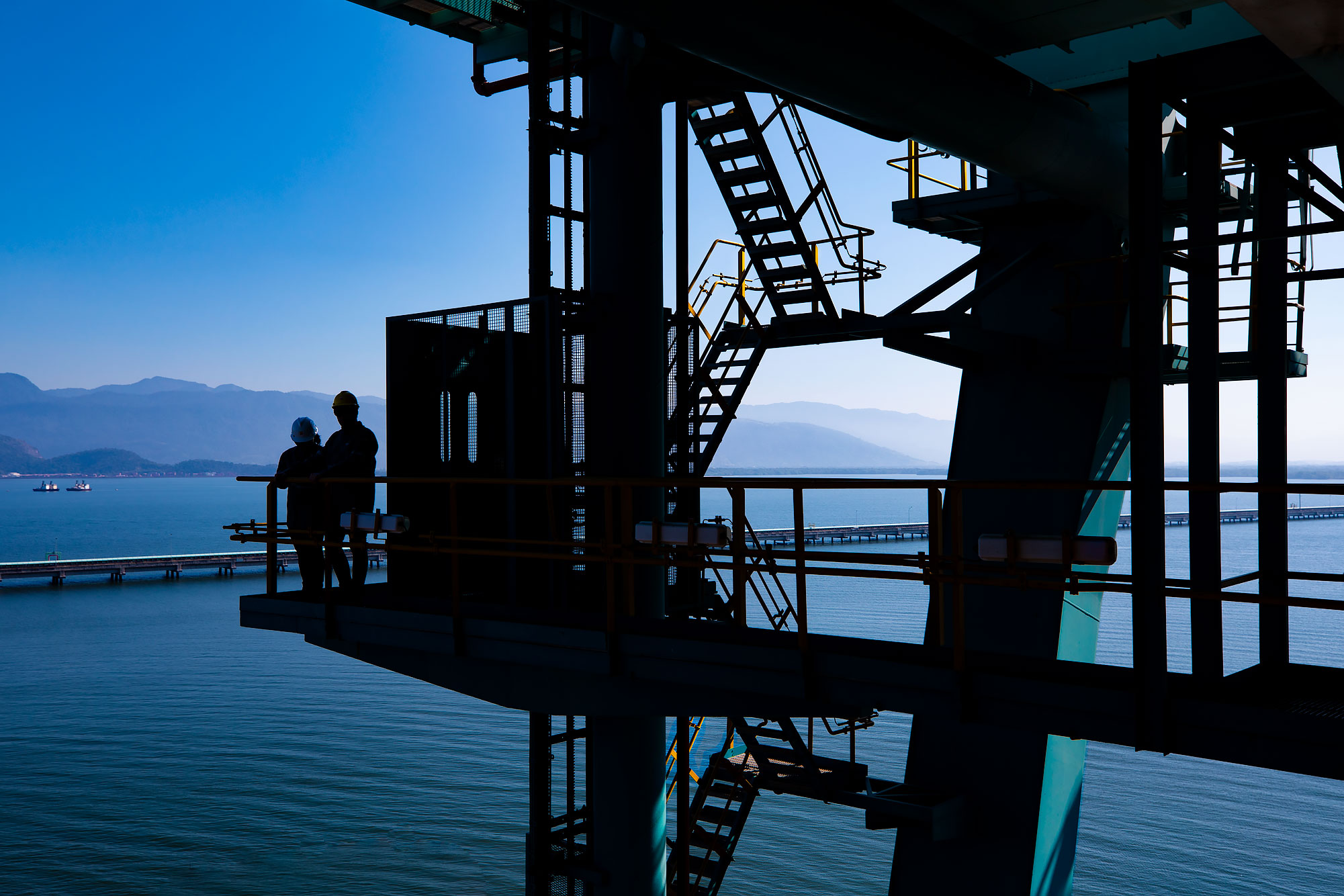 Industrial crane in silhouette in harbor | Scott Gable industrial photographer