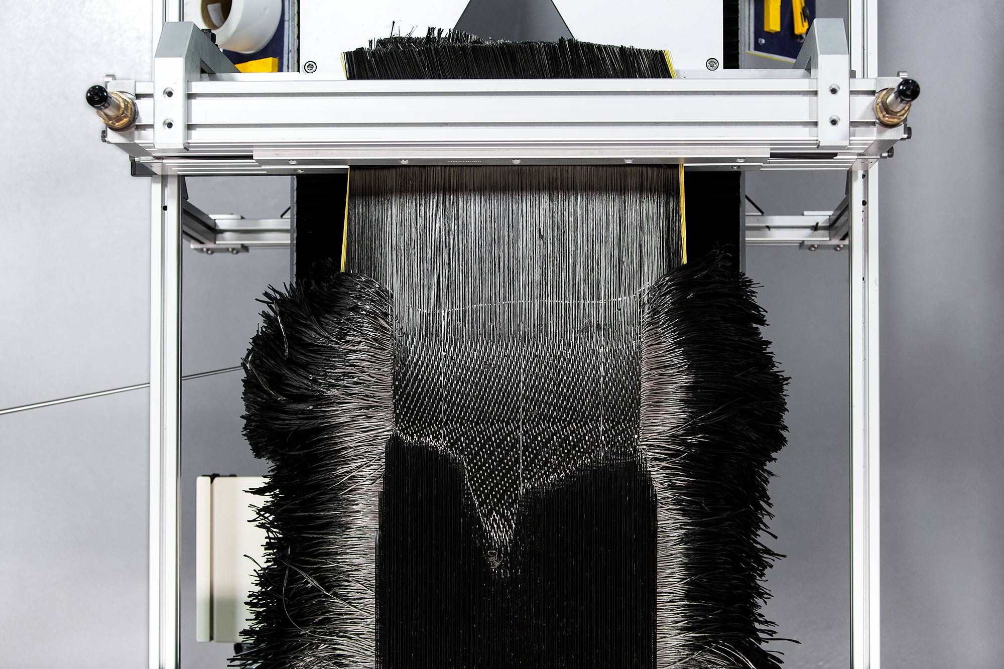 Carbon fiber loom weaving jet engine blade material | Scott Gable industrial photographer