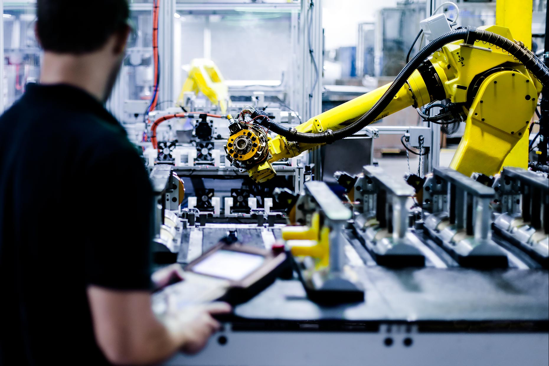 Technician operates robotic arm |  Scott Gable industrial photographer